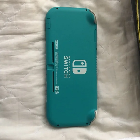 Nintendo Switch Lite with 3 games, 3 characters for Animal Crossing, and case.